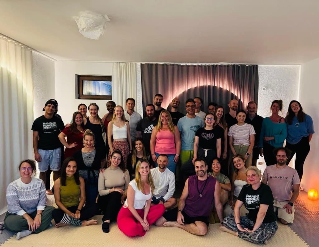 Workshop participants smiling together after a live Mind Artists session.